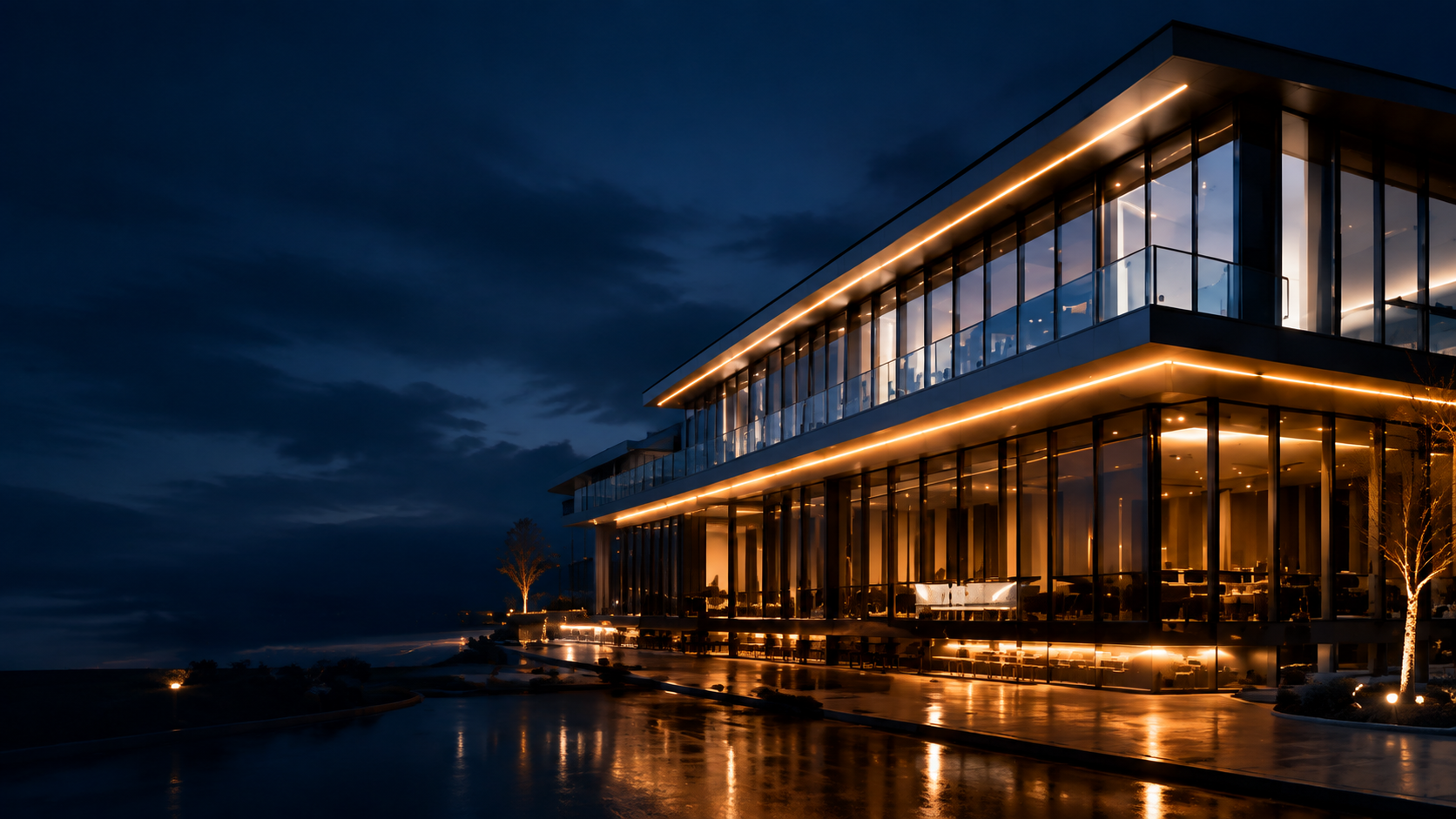 Modern glass building illuminated with warm architectural LED lighting
